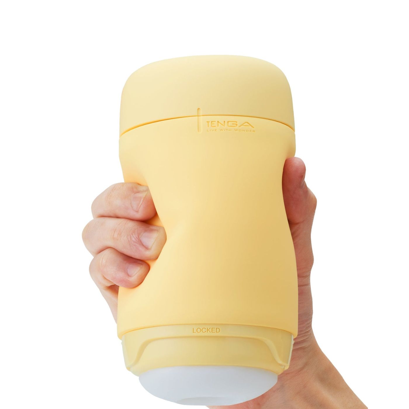 Puffy Penis sleeve i gul fra Tenga i hånd