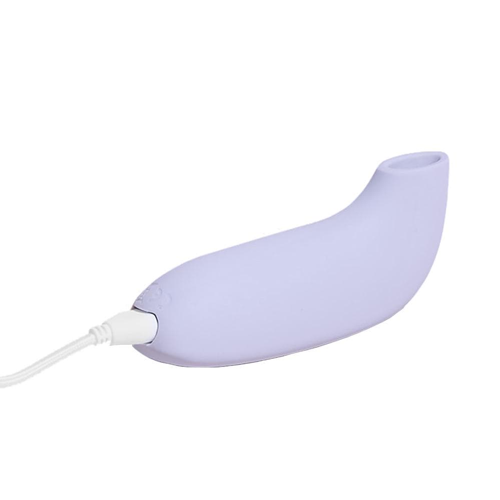 lavendelfarvet Aer suction klitoris vakuumvibrator fra dame products i oplader